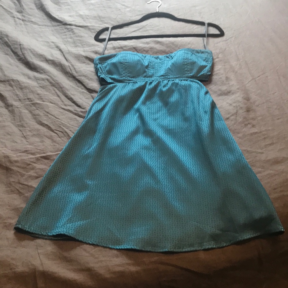 Teal cocktail dress with sides cut out